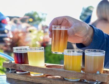 beer flight outside at a brewery
