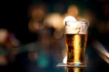 glass of beer with a blurry background
