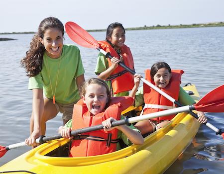 Girls on a canoe at summer camp