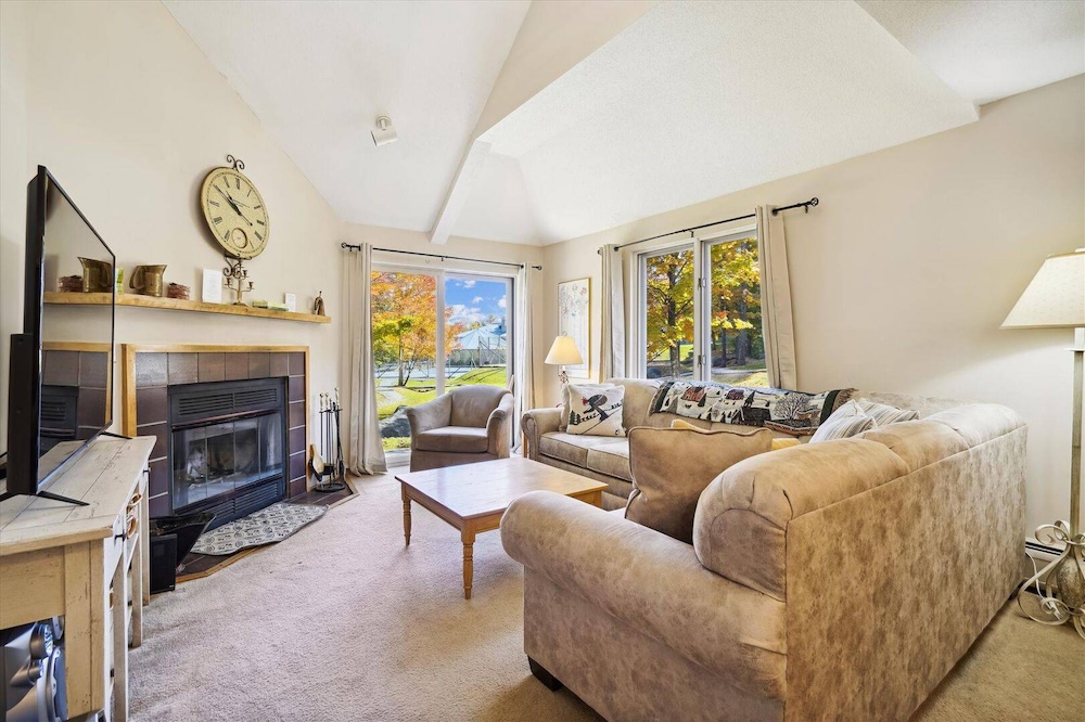 living room of killington rental with hot tub access