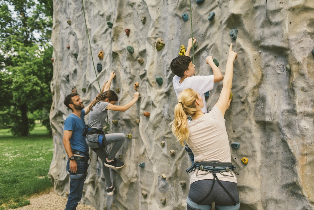 kids climbing on a rock wall