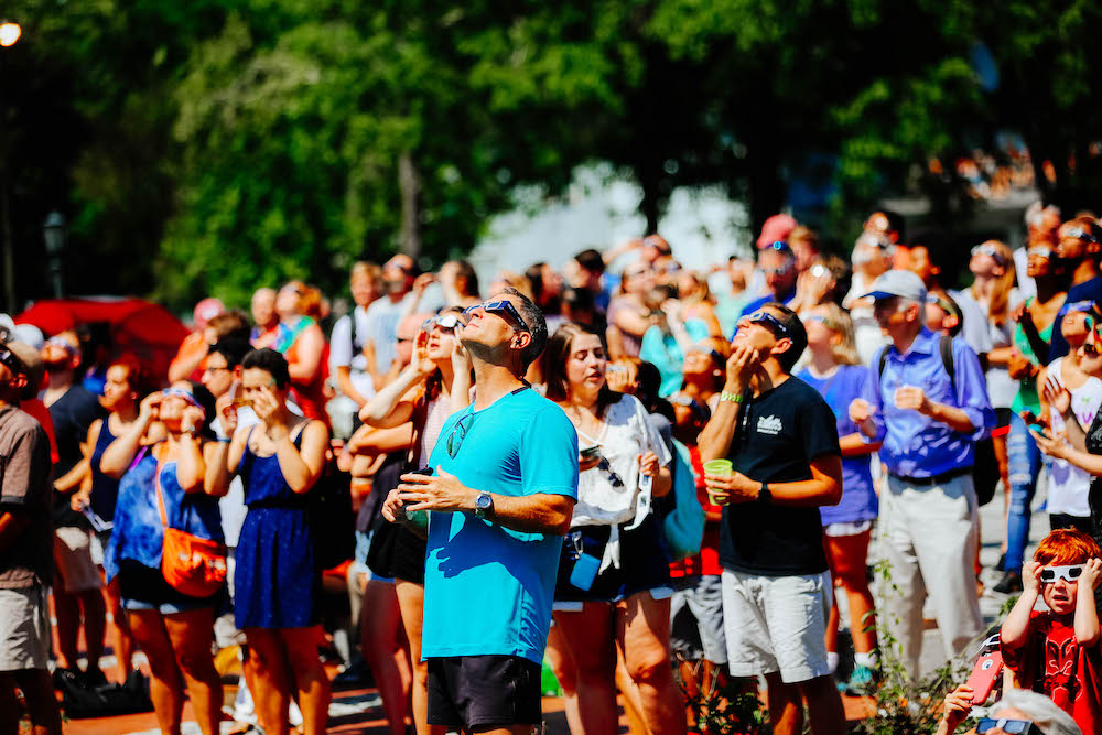 crowds watching total solar eclipse